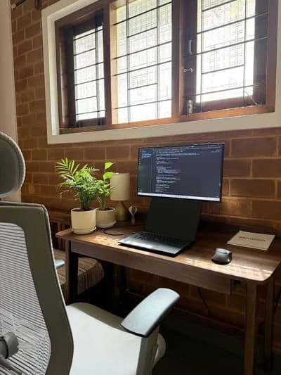 Sunlit Brick-Wall Coding Workspace