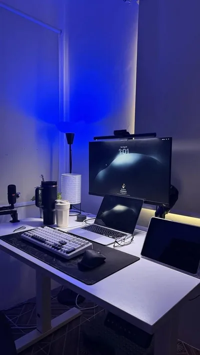 Blue-Lit Multi-Device Workspace