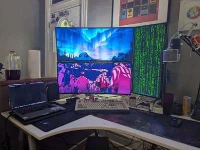 Blue and Magenta Triple-Monitor Gaming Battlestation