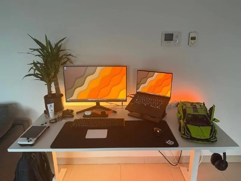 Orange-Lit Dual-Screen Workstation